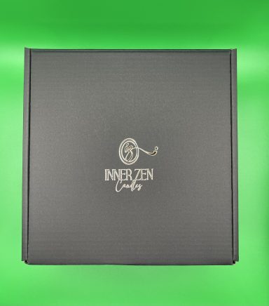 Dark grey square box with "INNERZEN" logo on the lid against a green background.