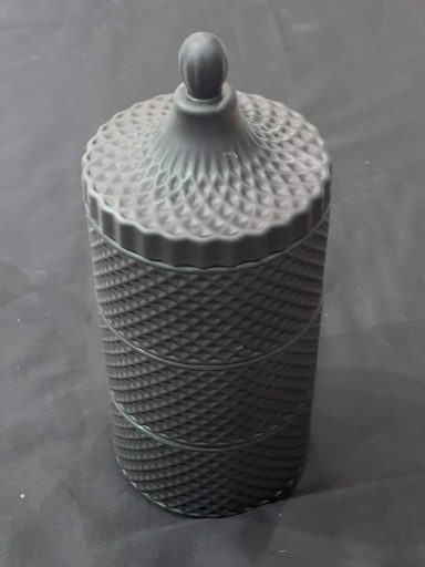 Decorative grey cylindrical container with a textured spiral pattern and lid.