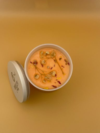 Top view of candle in white jar