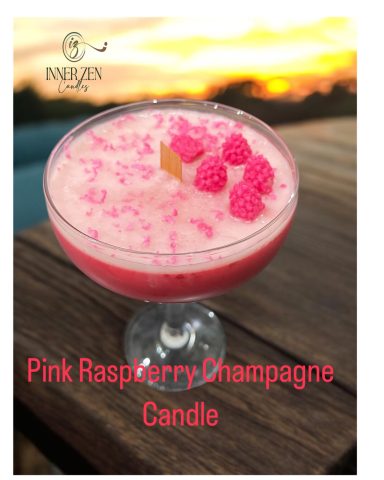 Raspberry scented candle with wax raspberries in a cocktail glass